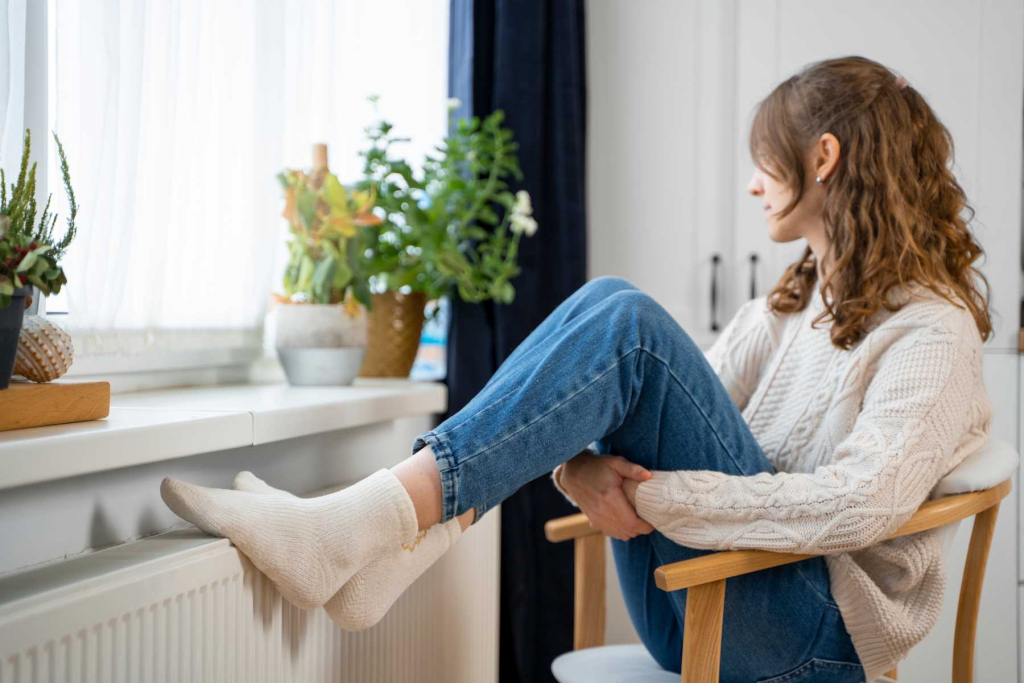 full-shot-woman-sitting-near-heater (1).jpg full-shot-woman-sitting-near-heater (1).jpg